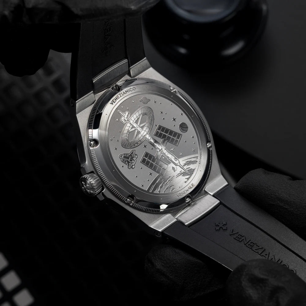 engraved caseback with satellite and space