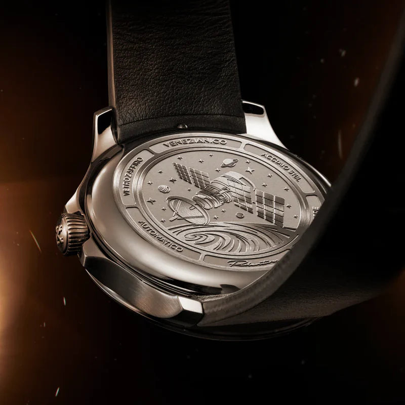 engraved caseback with space and satellite
